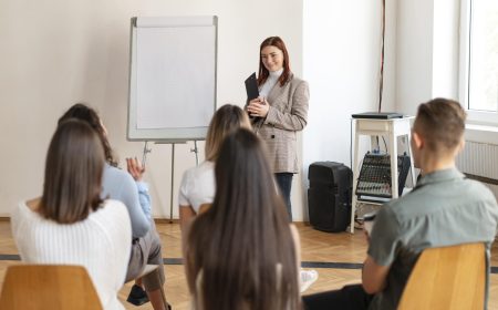 medium-shot-woman-leading-therapy-meeting