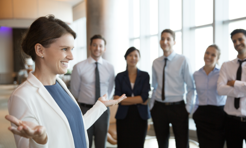 smiling-businesswoman-with-team
