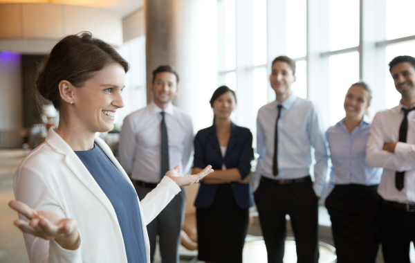 smiling-businesswoman-with-team smiling-businesswoman-with-team