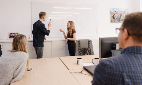 Shot of a male office worker giving presentation to his colleagues.
